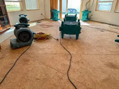 Drying equipment running on an exposed subfloor during a Fort Bend dry-out
