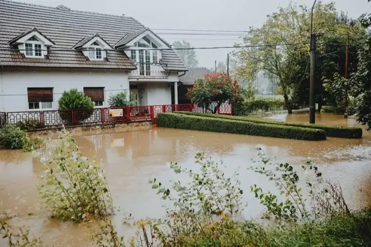 Rain water standing across a yard in a Fort Bend County neighborhood after a storm