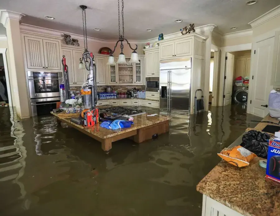 Flood water filling a kitchen in a Fort Bend County home after heavy rain